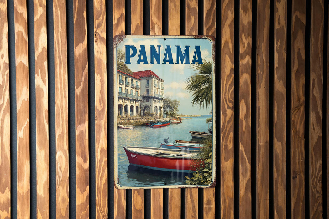 A vintage metal sign with the word "PANAMA" prominently displayed, featuring a scenic image of boats on a body of water.