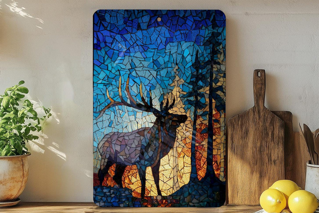 a vibrant mosaic artwork depicting a deer with large antlers, set against a backdrop of a forest. The artwork is displayed on a wooden shelf, with a potted plant and a wooden cutting board nearby.