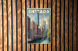 A vintage-style poster of Chicago, featuring a train and skyscrapers, is displayed on a wooden wall.