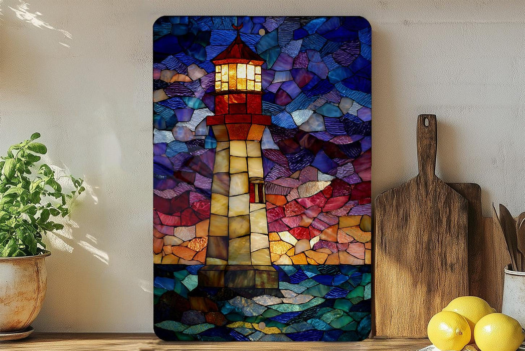 A vibrant stained glass artwork depicting a lighthouse is displayed on a wall, with a wooden cutting board and a potted plant nearby.