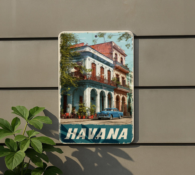 A vintage-style metal sign with a colorful image of a building and a car, mounted on a wall.