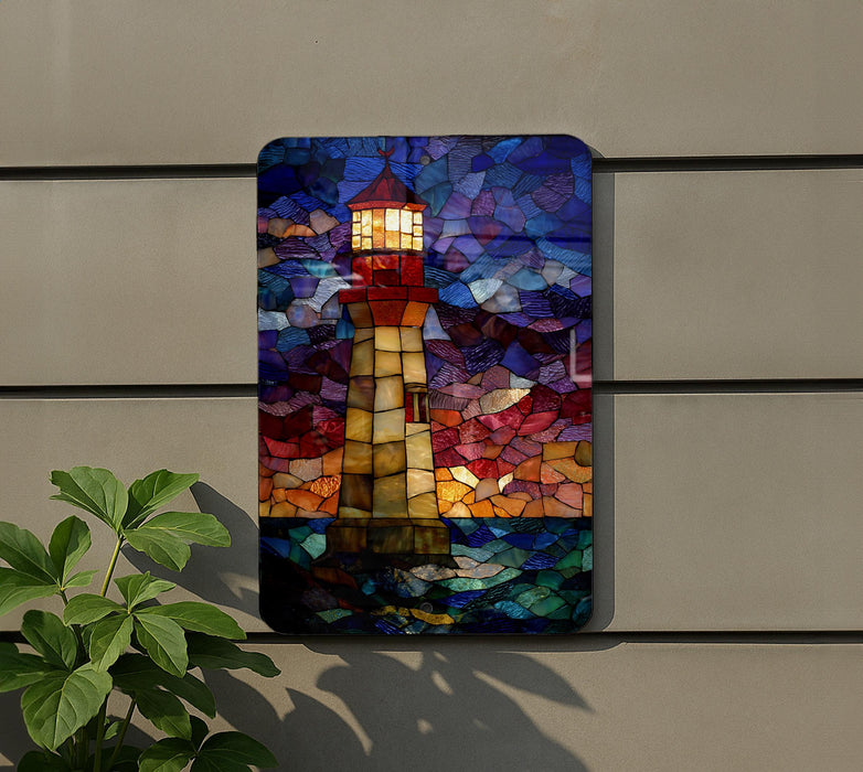 A colorful stained glass artwork depicting a lighthouse is displayed on a wall, with a plant visible to the left.