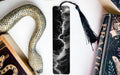a black and white bookmark with a lightning bolt design, accompanied by a black tassel, and a book titled "Practice" on a white surface.