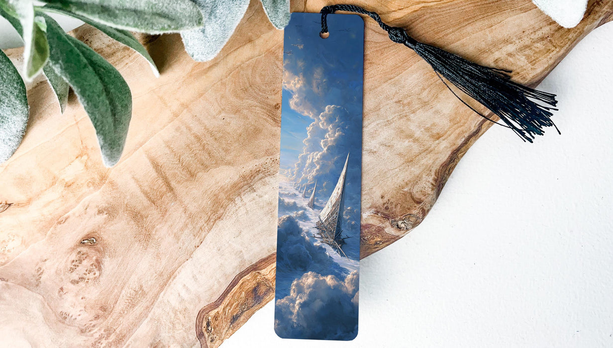 A wooden surface with a blue bookmark featuring a picture of a sailboat on the water.