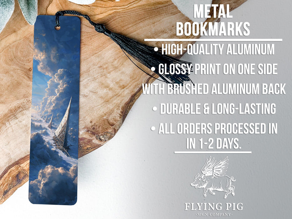 a metal bookmark with a sailboat on the clouds, placed on a wooden surface.