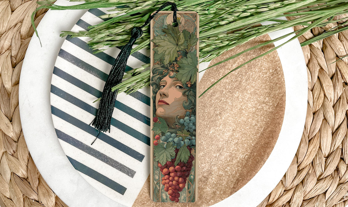 a decorative bookmark with a floral design, placed on a plate with a striped pattern.