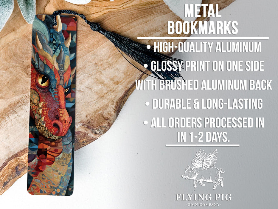 a dragon bookmark with a black tassel, placed on a wooden surface.