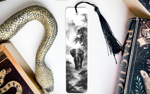a black and white photograph of an elephant walking through a forest, with a decorative snake and a book titled "Practice" on display.