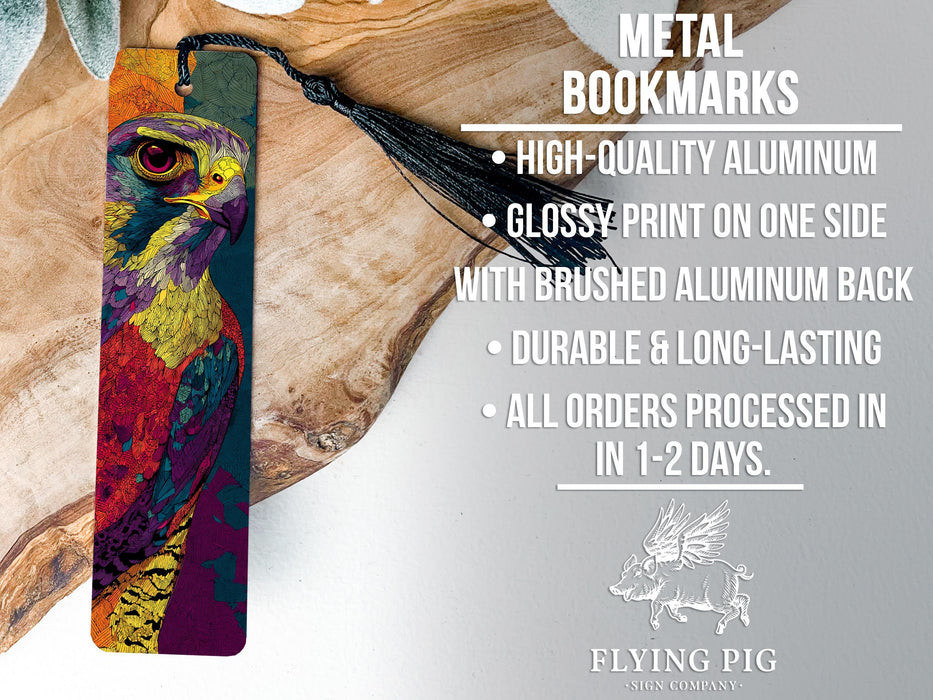 a metal bookmark with a colorful bird design, placed on a wooden surface.