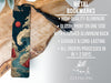 a metal bookmark with a detailed illustration of a wave and a red sun on it, placed on a wooden surface.