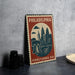 A vintage-style metal sign depicting the Philadelphia skyline, with a bell and the text "PHILADELPHIA PENNSYLVANIA USA" printed on it.