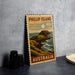 A metal stamp depicting a scenic coastal landscape with a mountain, ocean, and sky, along with the text "PHILLIP ISLAND 40c AUSTRALIA".