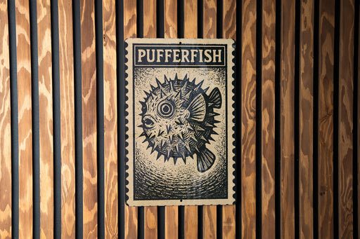 A black and white illustration of a pufferfish is displayed on a wooden wall.