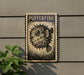 a pufferfish, a type of blowfish, depicted on a wooden plaque or sign.