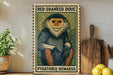 a framed illustration of a monkey, with the text "RED-SHANKED DOUC" and "PYGATHRIX NEMAEUS" printed on it. The monkey is sitting on a green background with a white border. The image is displayed on a shelf, with a potted plant, a wooden cutting board, and some lemons nearby.