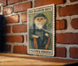 a poster of a monkey on a brick wall.