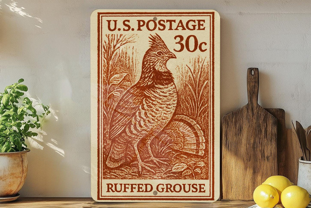 A U.S. postage stamp featuring a ruffed grouse, with a price of 30 cents, is displayed on a shelf next to a wooden cutting board and some lemons.