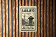 A vintage postage stamp from Sarajevo, Bosnia and Herzegovina, featuring a mosque and other architectural elements.