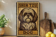 a sign with a dog illustration, placed on a shelf next to a wooden cutting board and some lemons.