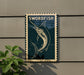 a swordfish graphic on a wall, with a plant to the left side.