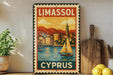a vintage-style metal sign with a colorful illustration of a sailboat on a body of water, surrounded by buildings and mountains, with the text "LIMASSOL" and "CYPRUS" prominently displayed.