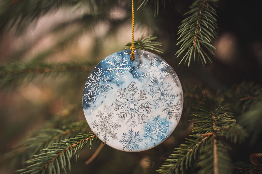 a snowflake ornament hanging from a christmas tree