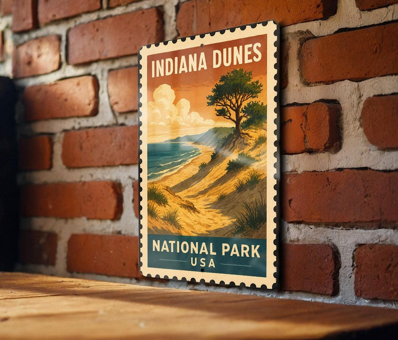 A vintage-style poster of Indiana Dunes National Park, featuring a scenic landscape with a tree, sand dunes, and a body of water.