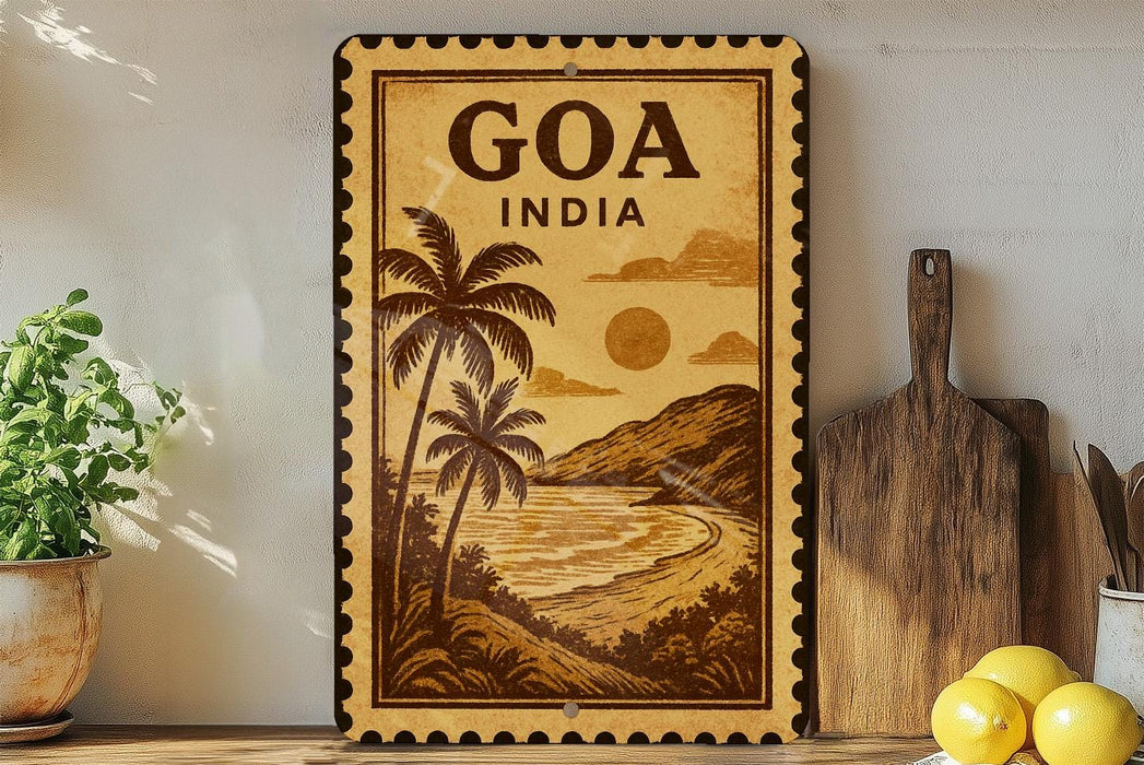 a vintage-style travel poster of Goa, India, with palm trees and a beach scene, displayed on a wall next to a wooden cutting board and some lemons.
