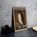A 25c US postage stamp featuring an illustration of a penguin, placed on a table next to some camera lenses.