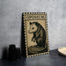 a metal plate with a stamp-like design, depicting a close-up of a small animal, possibly a rodent, with the word "OPOSSUM" written above it.
