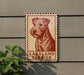 A sign featuring a red and white illustration of a Terrier dog, with the text "LAKELAND TERRIER" below it.
