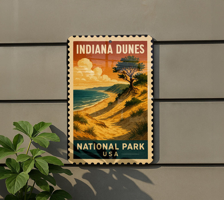 A vintage-style sign for Indiana Dunes National Park, featuring a scenic landscape with a beach, mountains, and a tree.
