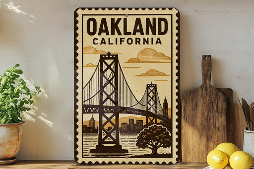 A framed vintage-style poster of the Golden Gate Bridge in Oakland, California, with a wooden cutting board and lemons on a shelf in the foreground.