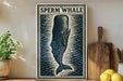 a decorative sign with a stylized illustration of a whale, placed on a wooden surface next to a wooden cutting board and some lemons.