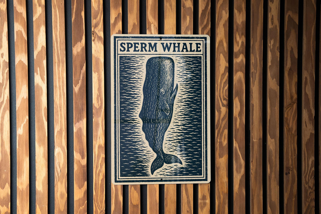 a sign with the text "SPERM WHALE" and a graphic of a whale.