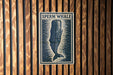 a sign with the text "SPERM WHALE" and a graphic of a whale.