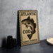A sign with the text "ATLANTIC COD GADUS MORHUA" and an illustration of a fish, likely representing the Atlantic Cod, is displayed on a table.