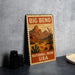 A metal sign with the text "BIG BEND NATIONAL PARK USA" and an illustration of a desert landscape with mountains and cacti.