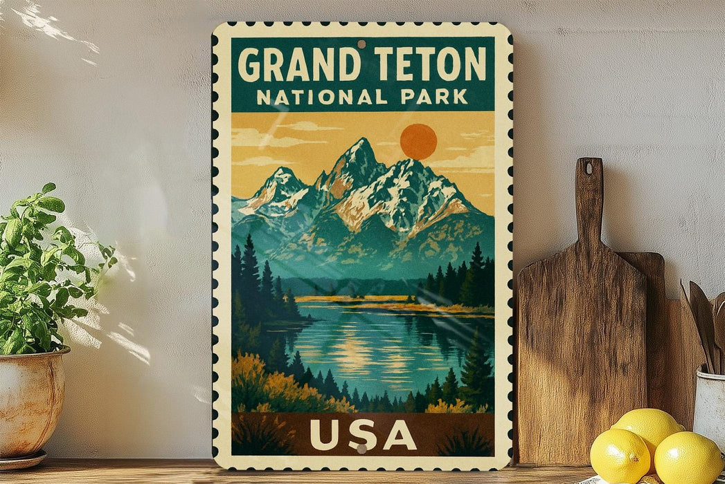 A vintage-style postage stamp depicting the Grand Teton National Park in the United States, with a scenic mountain landscape and a lake in the foreground.