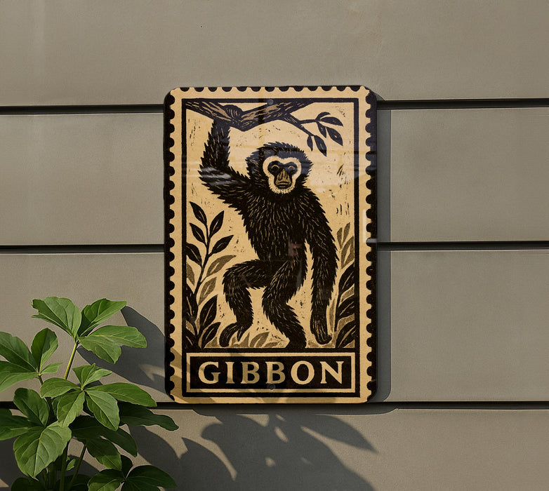 a wooden plaque with a monkey illustration on it, mounted on a wall next to a plant.