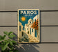 A vintage-style poster of a Greek village, featuring a sun, buildings, and a path, is displayed on a wall.
