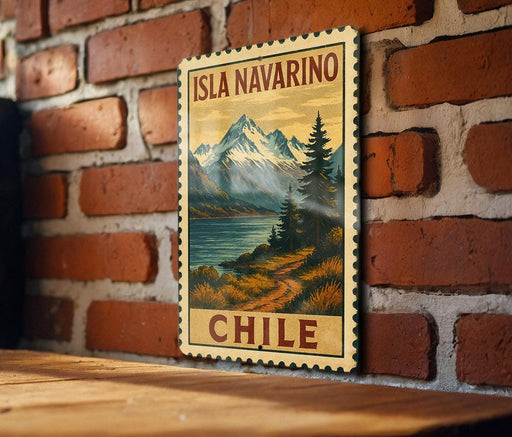 A vintage-style postage stamp depicting a scenic landscape with mountains, a lake, and a path, hanging on a brick wall.