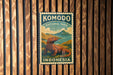 A vintage-style metal sign with a komodo lama illustration, mounted on a wooden wall.