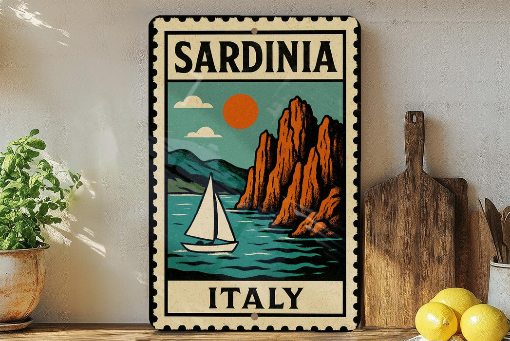A vintage-style metal sign with a sailboat and mountains in the background, depicting the scenic beauty of Sardinia, Italy.