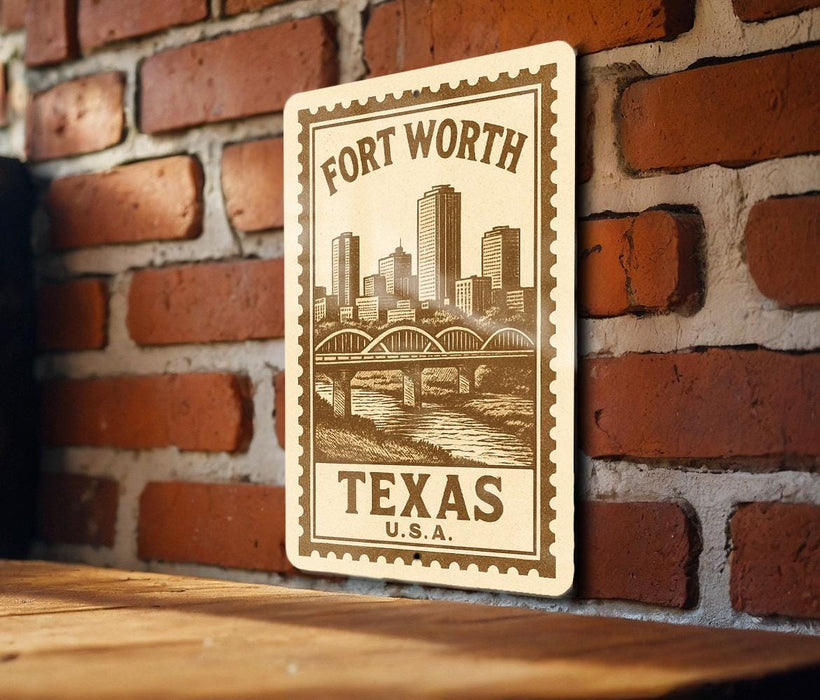 A wooden surface with a metal sign featuring a cityscape and a bridge, mounted on a brick wall.
