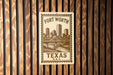 A metal sign with a printed image of Fort Worth, Texas, and the text "Fort Worth, TX, U.S.A."