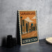 A vintage postage stamp from Uzbekistan featuring an illustration of a mosque and other architectural structures.