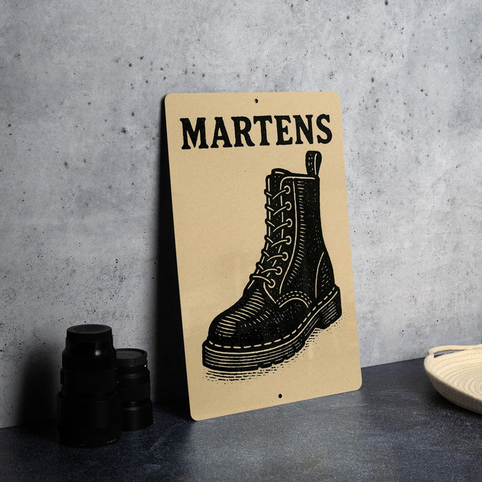 A sign with the word "MARTENS" printed on it, featuring an illustration of a black boot.