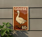 A sign featuring a cartoon goose, with the text "GOOSE" and "60c" printed on it.