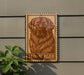 A wooden sign featuring a large illustration of a dog's face, with the word "LEONBERGER" written below it.